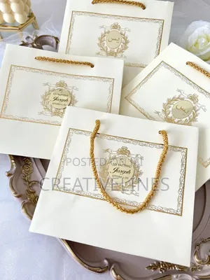 White Stylized Paper Bags - Chic Retail Carry Bags