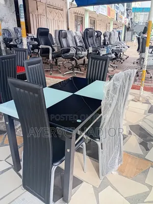 An Authentic Black Glass Dining Set